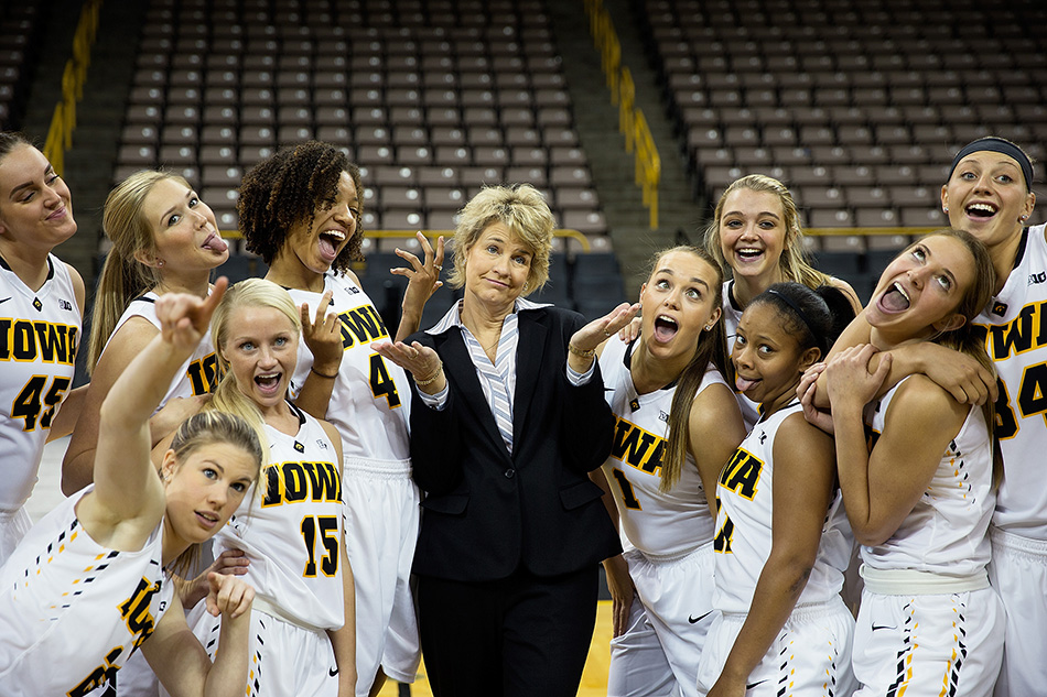 Head coach Lisa Bluder poses with members of her team at Iowa Women's Basketball Media Day at Carver-Hawkeye Arena in Iowa City on Thursday, Oct. 29, 2015. (Adam Wesley/The Gazette)